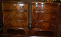 Lot 1385 - A pair of reproduction figured walnut...