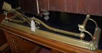 Lot 1387 - A late Victorian brass fire fender, together...