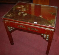 Lot 1390 - A Chinese red lacquered low occasional table,...