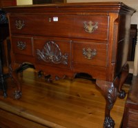 Lot 1395 - An American walnut four drawer lowboy in the...