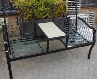 Lot 1140 - A black painted tubular metal integral twin...