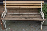 Lot 1138 - A white painted cast metal and slatted two...