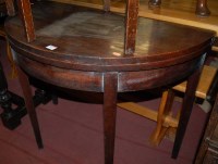 Lot 1412 - An early 20th century mahogany demi-lune fold...