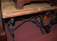 Lot 1418 - A beech topped and cast iron based rectangular...