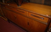 Lot 1443 - A 1960s G-Plan teak four door sideboard having...