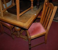 Lot 1309 - A 1930s light oak drawleaf dining table;...