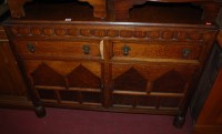 Lot 1386 - A 1930s moulded oak ledgeback double door...