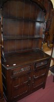 Lot 1430 - A contemporary dark elm kitchen dresser, width...