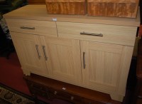 Lot 1402 - A contemporary light oak effect three door...