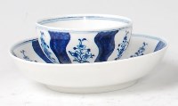 Lot 1083 - A Lowestoft porcelain tea bowl and saucer,...