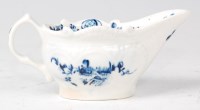 Lot 1085 - A Lowestoft porcelain sauceboat, underglaze...