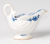 Lot 1086 - A Lowestoft porcelain cream jug, the scalloped...