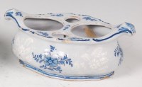 Lot 1095 - A Bristol Delft table stand, of shaped oval...