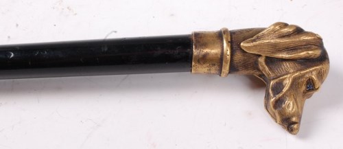 Lot 1331 - An ebony walking cane, having cast bronze...