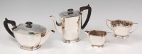 Lot 71 - An Art Deco style silver four piece tea and...