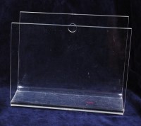 Lot 112 - A 1980s clear perspex wall mounted magazine...