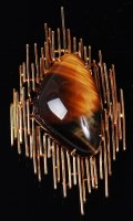 Lot 68 - A modern 18ct gold and tigers eye brooch, the...