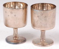 Lot 80 - A pair of 1960s silver pedestal wine goblets,...