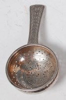 Lot 95 - A 1930s Liberty & Co silver tea strainer, the...