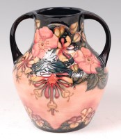 Lot 10 - A contemporary Moorcroft pottery twin handled...