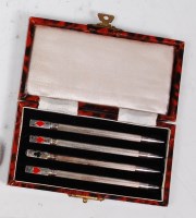 Lot 97 - A cased set of four Art Deco sterling silver...
