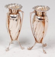 Lot 102 - A pair of Art Nouveau silver miniature three...