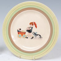 Lot 18 - A Clarice Cliff style pottery single dinner...