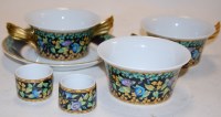 Lot 274 - A small collection of Versace gold ivory...