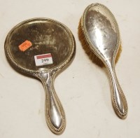 Lot 299 - A George V silver backed hand mirror together...