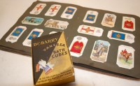 Lot 699 - An early 20th century album of cigarette cards...