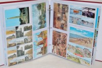 Lot 712 - An album of George V and later postcards,...