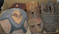 Lot 732 - A North African carved wooden tribal head-rest;...
