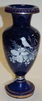 Lot 2 - A Victorian blue glass cameo vase of baluster...