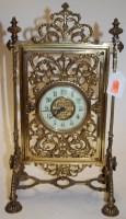 Lot 3 - A decorative Victorian pierced brass mantel...