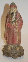Lot 9 - An early 20th century carved stone figure of a...