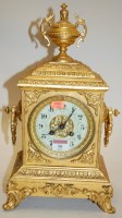 Lot 16 - A late 19th century French brass cased mantel...
