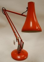Lot 24 - An orange painted angle-poise desk lamp