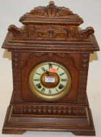 Lot 117 - A late 19th century oak cased mantel clock by...