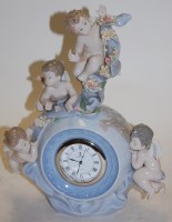 Lot 132 - A Lladro porcelain cased mantel clock,...