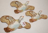 Lot 134 - A graduated set of three Beswick wall mounted...