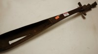 Lot 142 - A mid-20th century African carved wooden...