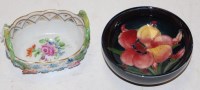 Lot 241 - A small Moorcroft pottery shallow bowl, on a...