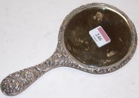 Lot 246 - An Edwardian silver backed hand mirror with...