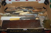 Lot 325 - A box of assorted carving knives and flatware...