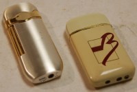 Lot 407 - A Ronson pocket cigarette lighter, and one...