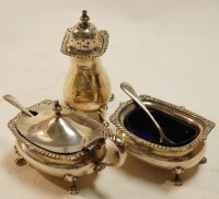 Lot 375 - A George V silver three piece cruet set...