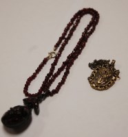 Lot 425 - A faceted and beaded garnet necklace with...