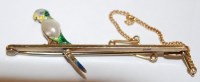 Lot 437 - A ladies 15ct gold bar brooch, set with enamel...