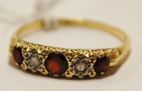 Lot 473 - A ladies 18ct gold diamond and garnet set five...