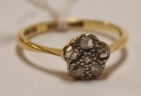 Lot 477 - An 18ct gold and platinum diamond flower head...